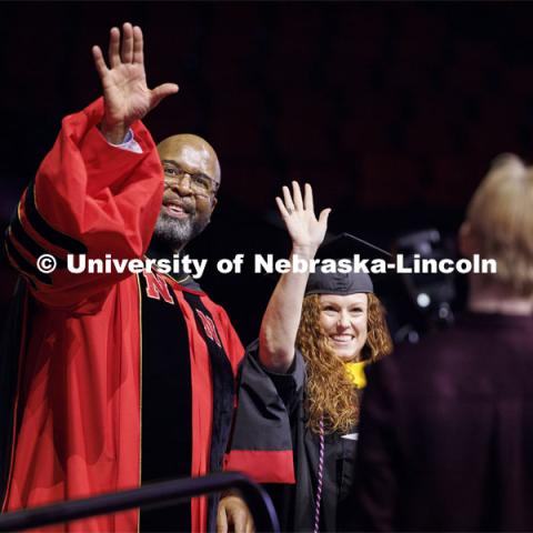 Nachole Carlson asked Chancellor Rodney Bennett to turn and wave with her at her family and friends after Carlson received her master’s in child, youth and family studies. Graduate Commencement at Pinnacle Bank Arena. December 15, 2023. Photo by Craig Chandler / University Communication and Marketing.