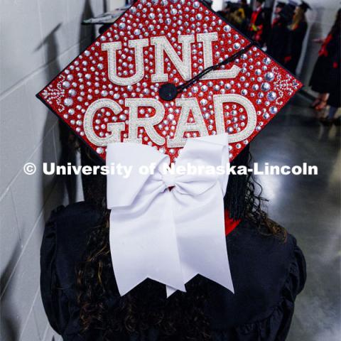 Monica Houston, CEHS grad, with her mortar board. Winter undergraduate commencement in Pinnacle Bank Arena. December 16, 2023. Photo by Craig Chandler / University Communication and Marketing.