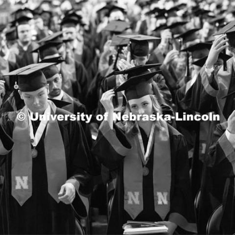 Undergraduate commencement move their tassels at the conclusion of commencement in Pinnacle Bank Arena. December 16, 2023. Photo by Craig Chandler / University Communication and Marketing.