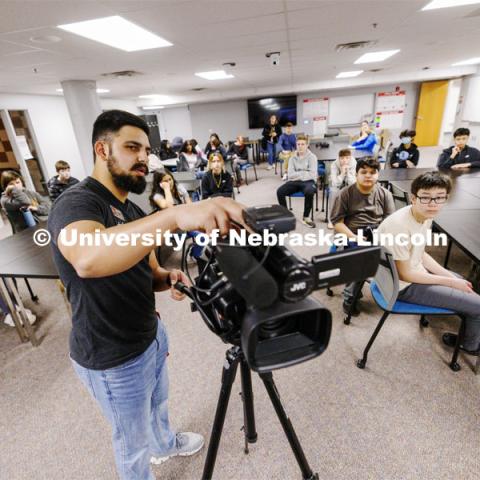 Alex Fernando leads a workshop for students from Lefler Middle School. Fernando and College of Journalism and Mass Communications ambassadors had the students taking photos, doing video shooting, social media posts and an advertising campaign. February 7, 2024. Photo by Craig Chandler / University Communication and Marketing.