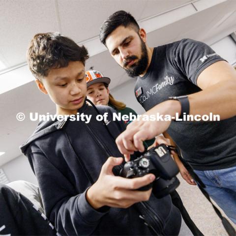 Alex Fernando leads a workshop for students from Lefler Middle School. Fernando and College of Journalism and Mass Communications ambassadors had the students taking photos, doing video shooting, social media posts and an advertising campaign. February 7, 2024. Photo by Craig Chandler / University Communication and Marketing.