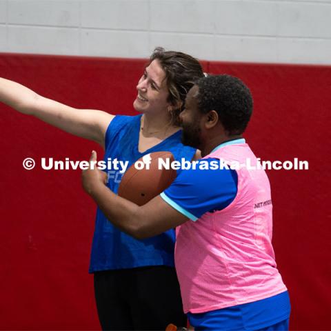Professor Jean Marcel Ngoko Djiokap takes a selfie with University of Nebraska-Lincoln student Delaney Knight at Cook Pavilion Field. Nebraska’s Jean Marcel Ngoko Djiokap is taking physics lessons from the lectern to athletic fields to connect with students. February 9, 2024. Photo by Kirk Rangel / University Communication.
