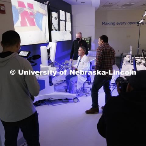 Dr. Theodoros “Ted” Voloyiannis of Texas Colon and Rectal Specialties in Houston, TX, concentrates while using the Space MIRA. Nebraska Engineering professor and Virtual Incision founder Shane Farritor successfully performed robotic surgery on the International Space Station. Controlled from the Virtual Incision offices in Lincoln, NE, surgeons cut rubber bands–mimicking surgery–inside a payload box on the International Space Station. February 10, 2024. Photo by Craig Chandler / University Communication and Marketing.