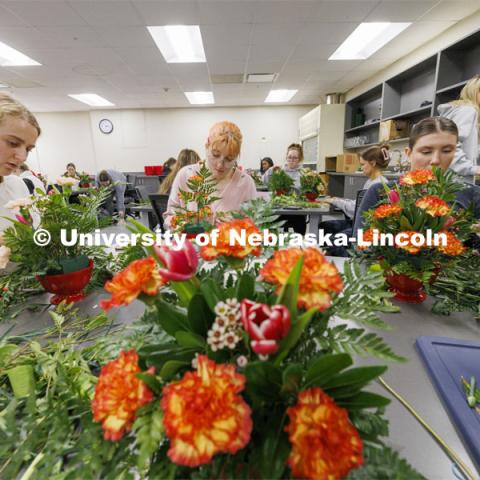 Students making floral arrangements. Stacy Adams teaches PLAS 261 - Floral Design I in the Plant Science Building on East Campus. February 14, 2024. Photo by Craig Chandler / University Communication and Marketing.