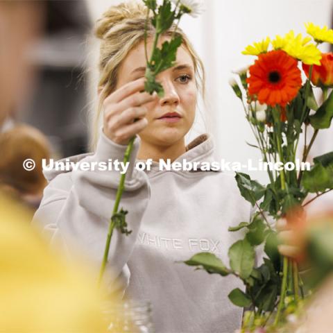 Emily Boyle, a senior Speech-Language Pathologist student designs her bouquet in PLAS 261 - Floral Design I in the Plant Science Building. February 21, 2024. Photo by Craig Chandler / University Communication and Marketing