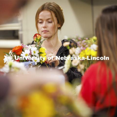 Kaitlin Mack, a senior Finance student designs her bouquet in PLAS 261 - Floral Design I in the Plant Science Building. February 21, 2024. Photo by Craig Chandler / University Communication and Marketing.