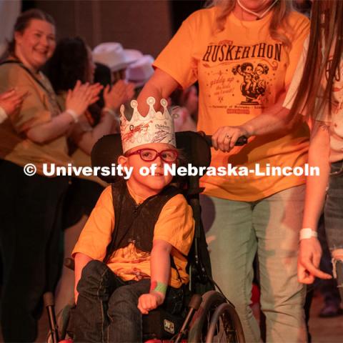 A miracle child is wheeled into the Dance Marathon. HuskerThon Dance Marathon 2024. University of Nebraska–Lincoln students raised $83,702.24 during the annual HuskerThon. Also known as Dance Marathon, the event is part of a nationwide fundraiser supporting Children’s Miracle Network Hospitals. The annual event, which launched in 2006, is the largest student philanthropic event on campus. The mission of the event encourages participants to, “dance for those who can’t.” All funds collected by the Huskers benefit the Children’s Hospital and Medical Center in Omaha. March 2, 2024. Photo by Kirk Rangel.