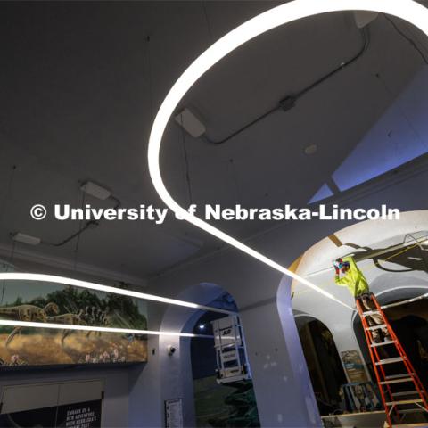 Shane McCreedy with Shanahan Electric works on wiring above the main reception desk in Morrill Hall. Workers are rushing to finish renovations to improve accessibility and better protect its exhibits and research specimens so the University of Nebraska State Museum and Mueller Planetarium can reopen to the public on March 15, 2024. March 4, 2024. Photo by Craig Chandler / University Communication and Marketing.