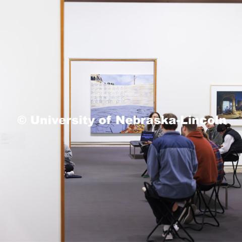 Katie Anania talks with students as they study in the in the Unprecedented: Art in Times of Crisis exhibit space. Anania’s AHIS 381: Visualizing Crisis. Professors using the Sheldon Museum of Art as part of their classroom teaching. Photos for Nebraska Quarterly alumni magazine. March 7, 2024. Photo by Craig Chandler / University Communication and Marketing.