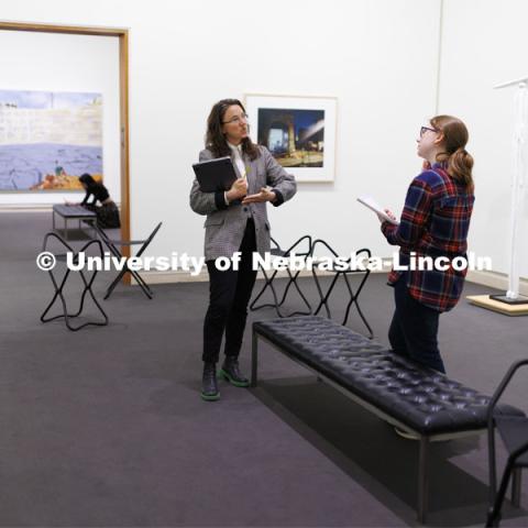 Katie Anania talks with Sofie Curto as they study in the in the Unprecedented: Art in Times of Crisis exhibit space. Anania’s AHIS 381: Visualizing Crisis. Professors using the Sheldon Museum of Art as part of their classroom teaching. Photos for Nebraska Quarterly alumni magazine. March 7, 2024. Photo by Craig Chandler / University Communication and Marketing.