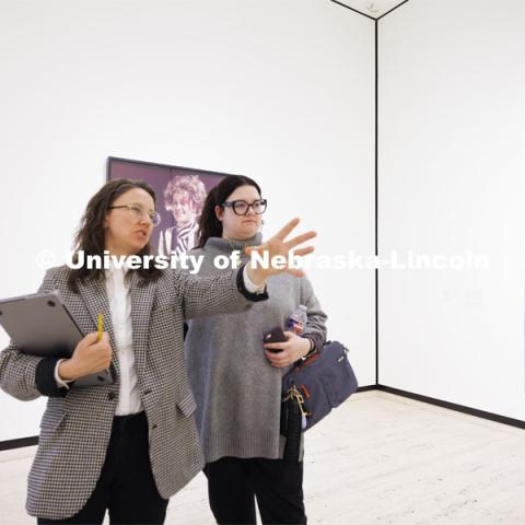 Katie Anania talks with Bella Galindo as they study in the in the Unprecedented: Art in Times of Crisis exhibit space. Anania’s AHIS 381: Visualizing Crisis. Professors using the Sheldon Museum of Art as part of their classroom teaching. Photos for Nebraska Quarterly alumni magazine. March 7, 2024. Photo by Craig Chandler / University Communication and Marketing.