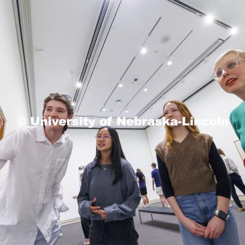 Courtney Hillebrecht, right, listens as, from left, Alex Halvorsen, Jada Sems and Josie Lahm discuss a photograph hanging in the Unprecedented: Art in Times of Crisis exhibit. Courtney Hillebrecht’s POLS 160: International Relations. Professors using the Sheldon Museum of Art as part of their classroom teaching. Photos for Nebraska Quarterly alumni magazine. March 7, 2024. Photo by Craig Chandler / University Communication and Marketing.