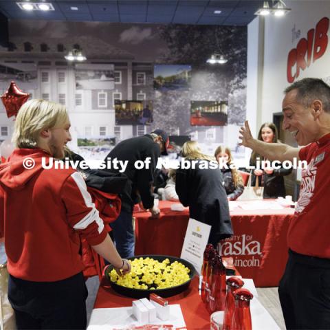 Chris Ebbers, right, reacts as Jeremiah Mohring of Elkhorn, Nebraska, won a gift certificate by picking a lucky duck from a floating pond. Admitted Student Day is UNL’s in-person, on-campus event for all admitted students. March 23, 2024. Photo by Craig Chandler / University Communication and Marketing.