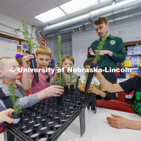 Jack Hilgert, Conservation Education Coordinator for the Nebraska Forest Service, teaches second graders about trees at Humboldt-Table Rock-Steinauer school in Humboldt, Nebraska. Each student was given a Colorado blue spruce seedling to raise in the classroom while they learn about trees. March 25, 2024. Photo by Craig Chandler / University Communication and Marketing.