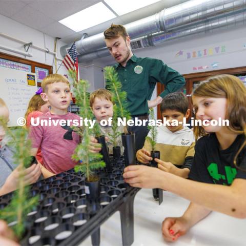 Jack Hilgert, Conservation Education Coordinator for the Nebraska Forest Service, answers second graders’ questions about their new Colorado blue spruce seedlings they will be growing in their Humboldt Table Rock-Steinauer school classroom in Humboldt, Nebraska. Each student was given a seedling to raise in the classroom while they learn about trees. March 25, 2024. Photo by Craig Chandler / University Communication and Marketing.