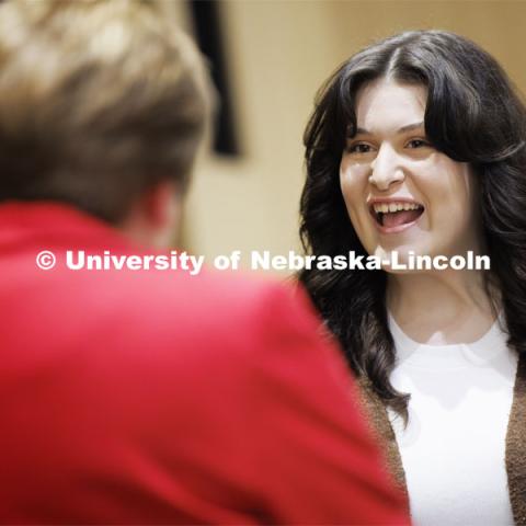 Aspiring teacher Hannah Reynolds of Papillion, Nebraska, talks with CEHS 2024 alumni master Marilyn Moore after Moore presented her with her pin. The second-year student has been admitted to the elementary education program in the College of Education and Human Sciences. April 5, 2024. Photo by Craig Chandler / University Communication and Marketing.