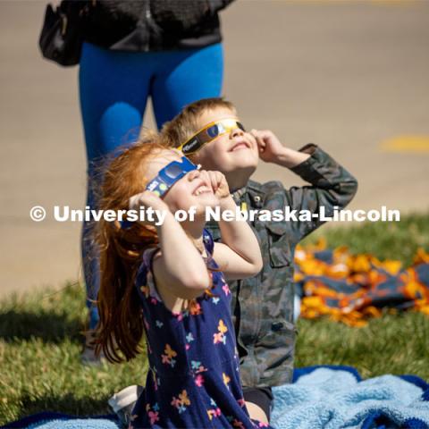 Kids join in on the fun wearing special glasses to see the eclipse at the East Campus' Solar Social. April 8, 2024. Photo by Kristen Labadie / University Communication.