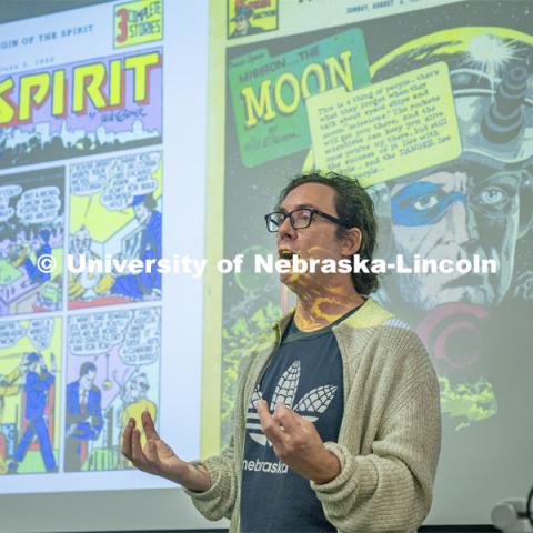 Richard Graham introduces Will Eisner, the comic book artist his Graphic Novels as History (HIST 256) class is discussing this week. April 16, 2024. Photo by Kristen Labadie / University Communication.