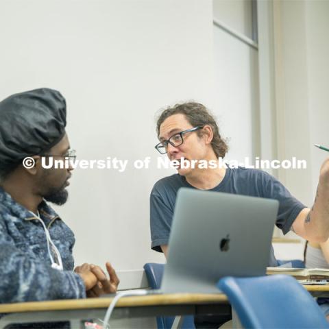 Tristian Swift (left) a Junior English major talks about his final project with Professor Richard Graham during the Graphic Novels as History (HIST 256) class. April 16, 2024. Photo by Kristen Labadie / University Communication.