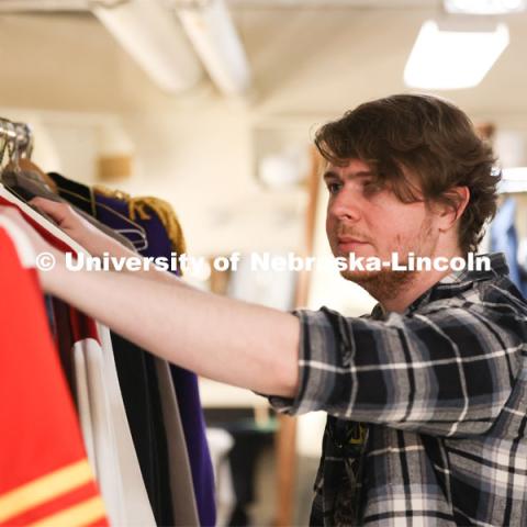 Hunter Rock organizes costumes for UNL’s production of “Big Fish”. April 23, 2024. Photo by Taryn Hamill for University Communication and Marketing.