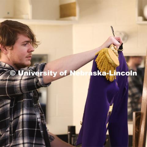 Hunter Rock organizes costumes for UNL’s production of “Big Fish”. April 23, 2024. Photo by Taryn Hamill for University Communication and Marketing.