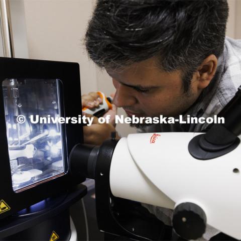 Eduardo Romero, Research Assistant Professor, loads a sample to be checked before being placed in the Cryo-Transmission Electron Microscope. CyroEM Core Facility in the Morrison Center on UNL’s East Campus. April 23, 2024. Photo by Craig Chandler / University Communication and Marketing.