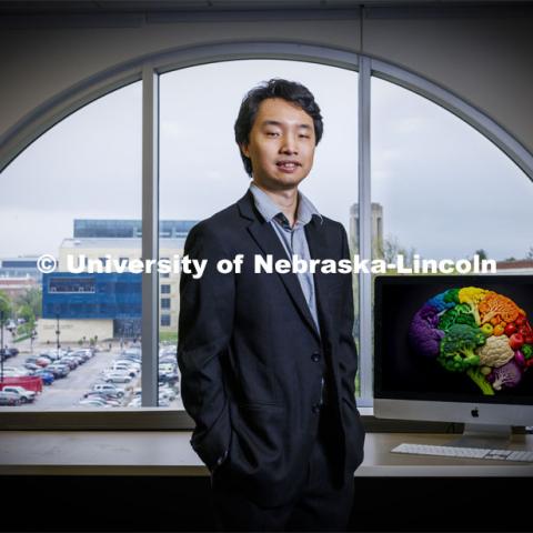 Jisheng Wu is pictured in an office setting. Professor Aron Barbey and graduate student Jisheng Wu have published research on nutrition and the brain. April 26, 2024. Photo by Craig Chandler / University Communication and Marketing.