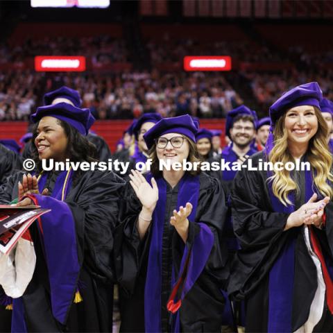 The crowd applauds Damon O. Barry, managing partner of Ballard Spahr in Denver and a 2000 Nebraska Law graduate, during his commencement speech. College of Law commencement in Devaney on the volleyball court. May 3, 2024. Photo by Craig Chandler / University Communication and Marketing.