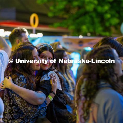 Two friends hug as they watch Cherry Glazerr perform on the main stage at the 20th Annual Lincoln Calling Festival outside the Union on City Campus. May 3, 2024. Photo by Kristen Labadie / University Communication.