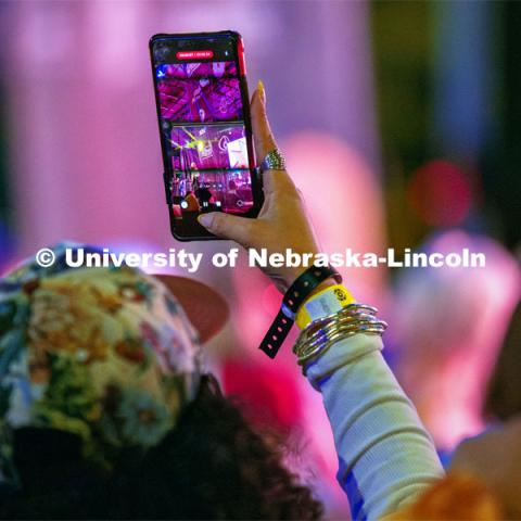 A fan snaps a photo of Cherry Glazerr performs on the main stage at the 20th Annual Lincoln Calling Festival outside the Union on City Campus. May 3, 2024. Photo by Kristen Labadie / University Communication.