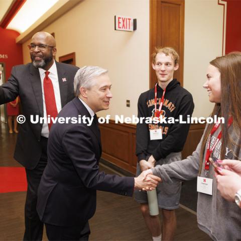 Canadian Minister Francois-Philippe Champagne introduced himself to touring high school students Camryn Fisher of Elkhorn, right, and Maxwell Pritchett Peterson of Lincoln as Chancellor Rodney Bennett greeted the Canadian. Champage is on campus today to have a fireside chat with Jill O’Donnell of the Yeutter Institute. May 3, 2024. Photo by Craig Chandler / University Communication and Marketing.