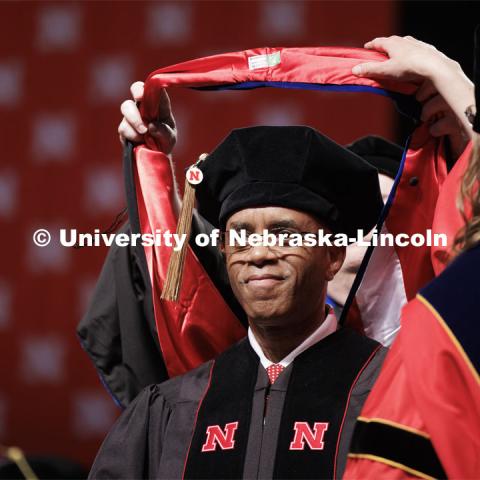 UNLPD Police Chief Hassan Ramzah receives his Doctor of Education hood. Graduate Commencement. May 17, 2024. Photo by Craig Chandler / University Communication and Marketing.