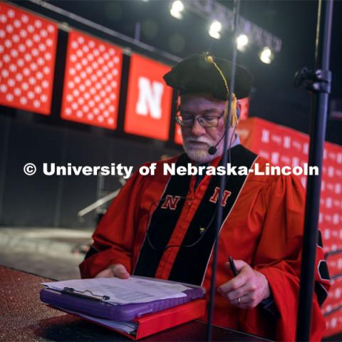 Dr. Robert Gorman works on running UNL’s Graduate Commencement. May 17, 2024. Photo by Kristen Labadie / University Communication.