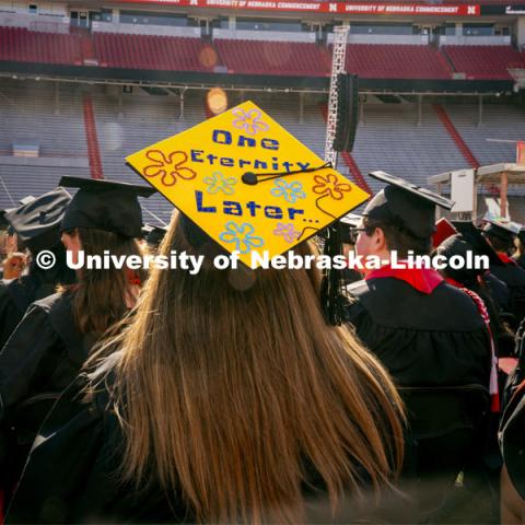 Kristen Perez, a Political Science major, wears her SpongeBob-themed decorated mortar board at Commencement. Undergraduate Commencement in Memorial Stadium. May 18, 2024. Photo by Kristen Labadie / University Communication.