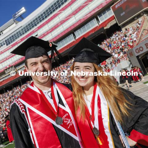 Jack Kinney and his twin, Hannah-Kate Kinney are wearing big smiles for commencement. Undergraduate Commencement in Memorial Stadium. May 18, 2024. Photo by Craig Chandler / University Communication and Marketing.