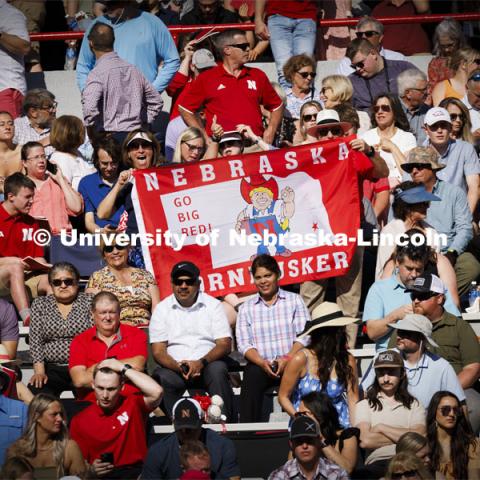 Rachel Morros’ parents brought their Husker flag from their home in California to help celebrate their daughter’s graduation. Undergraduate Commencement in Memorial Stadium. May 18, 2024. Photo by Craig Chandler / University Communication and Marketing.