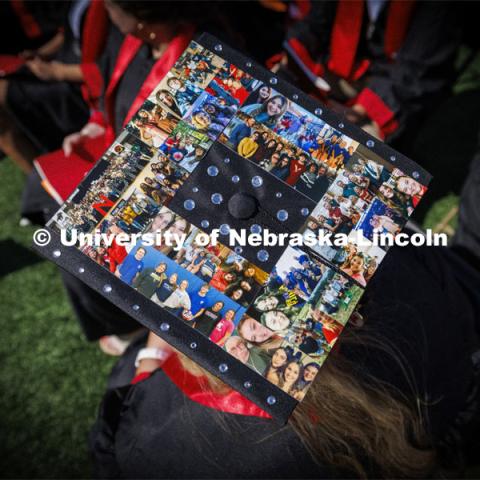 Mackenzi Berglund decorated her mortar board with photos of family and friends. Undergraduate Commencement in Memorial Stadium. May 18, 2024. Photo by Craig Chandler / University Communication and Marketing.