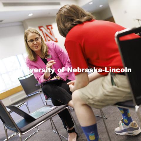 Jenni Brost, Director of New Student Enrollment, and orientation leader Dalton Cooper review a video being planned for NSE. May 23, 2024. Photo by Craig Chandler / University Communication and Marketing.
