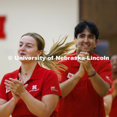 Madison Sheets runs towards the stage in the Centennial Ballroom as the NSE Orientation Leaders do their welcome and closing sessions to the summer academic advisors attending a luncheon. New Student Enrollment. May 23, 2024. Photo by Craig Chandler / University Communication and Marketing.