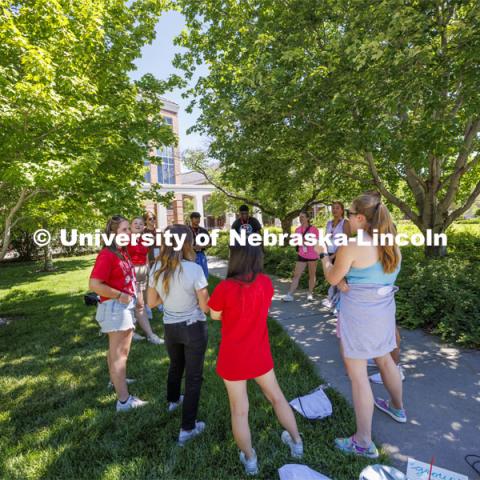 Makayla Larntz has her group in the shade as they play an ice-breaker game. NSE New Student Enrollment. June 5, 2024. Photo by Craig Chandler / University Communication and Marketing.