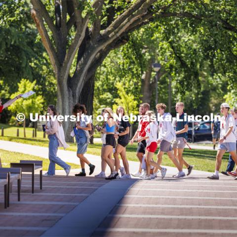 Jameson Margetts leads his group across campus to their next rotation. NSE New Student Enrollment. June 5, 2024. Photo by Craig Chandler / University Communication and Marketing.