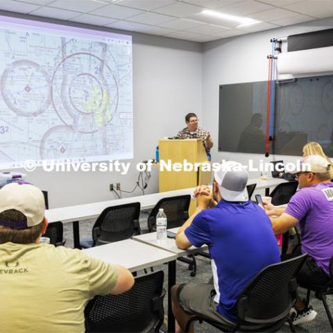 Travis Ray from Nebraska Innovation Studios dissects aeronautical sectional charts so the future drone pilots can learn where they can and can’t fly. Ray, from Nebraska Innovation Studios is teaching drone classes so people can get their p107 license to fly. June 18, 2024. Photo by Craig Chandler / University Communication and Marketing.