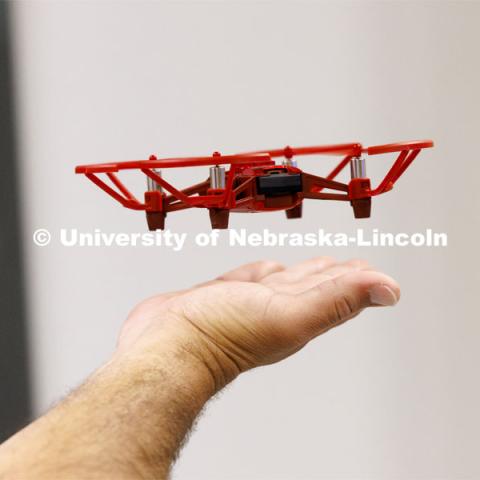 A small UAV lands on the hand of Brandon Mowinkel, a teacher at Milford Public Schools. Travis Ray from Nebraska Innovation Studios is teaching drone classes so people can get their p107 license to fly. June 18, 2024. Photo by Craig Chandler / University Communication and Marketing.