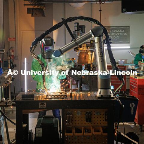 Filming Nebraska Innovation Studios welding robot. Behind the scenes photo for the university's new "Home Again" national advertisement. June 25, 2024. Photo by Kristen Labadie / University Communication.   