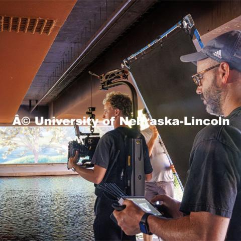 A film crew records downtown Omaha. Behind the scenes photo for the university's new "Home Again" national advertisement. June 26, 2024. Photo by Kristen Labadie / University Communication.   