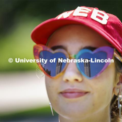 Mueller Tower is reflected in Saylor Newman’s sunglasses. Saylor is an incoming Fine and Performing Arts student on campus for New Student Enrollment. Final day of 2024 New Student Enrollment. July 11, 2024. Photo by Craig Chandler / University Communication and Marketing.