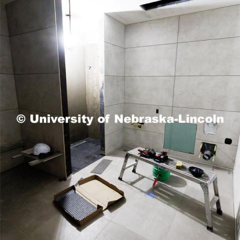 One of the new inclusive locker rooms. Construction continues to renovate the locker rooms and a new weight training and conditioning area. July 30, 2024.  Photo by Craig Chandler / University Communication and Marketing