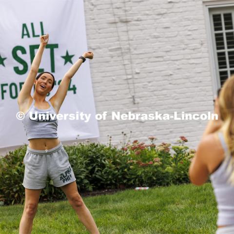 Jane Anderson dances for Anna Walters as the two Alpha Phi members try out camera angles for Tik Tok videos the sorority plans to make as part of recruitment. City Campus. August 16, 2024. Photo by Craig Chandler / University Communication and Marketing.