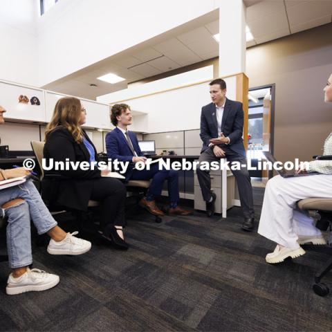 Professor Ryan Sullivan, center, talks with law students in the Estate Planning Clinic. College of Law Clinics. September 19, 2024. Photo by Craig Chandler / University Communication and Marketing.