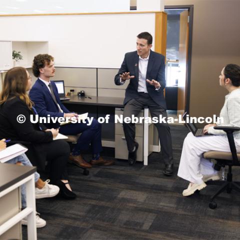 Professor Ryan Sullivan, center, talks with law students in the Estate Planning Clinic. College of Law Clinics. September 19, 2024. Photo by Craig Chandler / University Communication and Marketing.